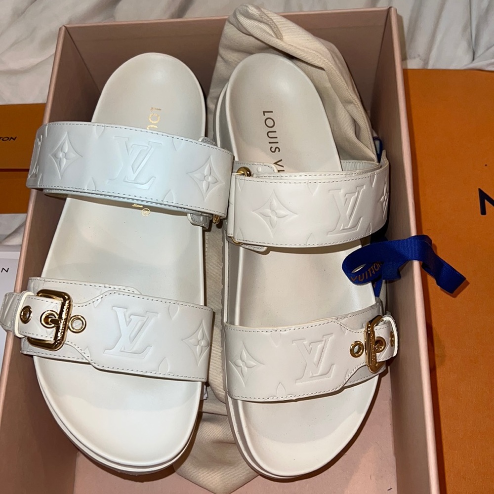 Louis Vuitton off white slides. Size 7.5